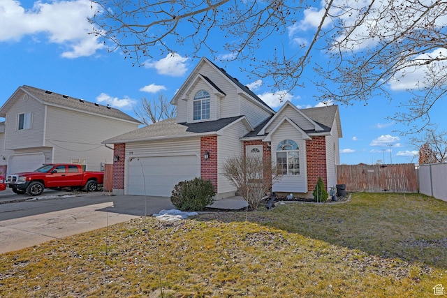 traditional home with a front lawn, brick siding, driveway, and fence