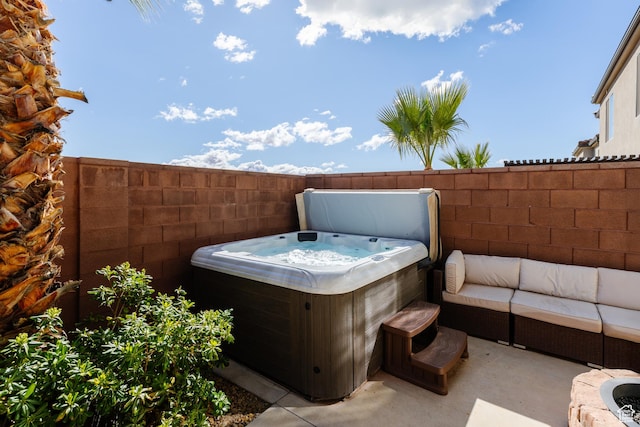 560 N Ventura Ln, Washington, UT 84780 - view of patio / terrace featuring a hot tub and fence