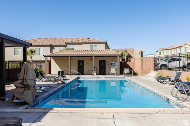 560 N Ventura Ln, Washington, UT 84780 - pool with a patio area, a residential view, and fence