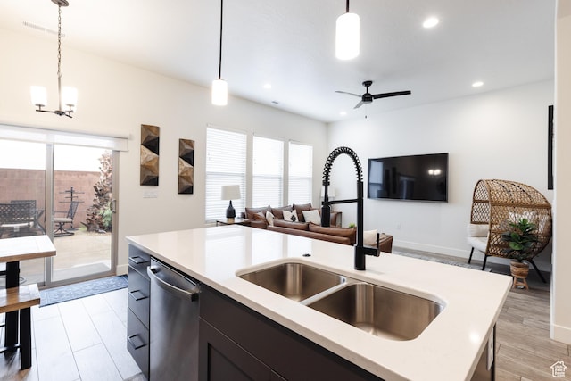560 N Ventura Ln, Washington, UT 84780 - kitchen featuring a sink, light countertops, open floor plan, and stainless steel dishwasher