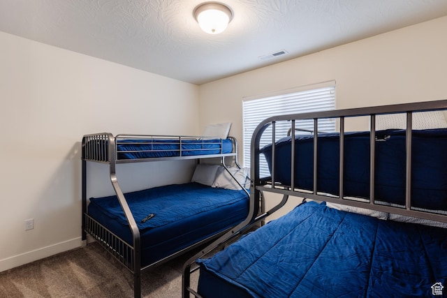 560 N Ventura Ln, Washington, UT 84780 - carpeted bedroom with visible vents, baseboards, and a textured ceiling