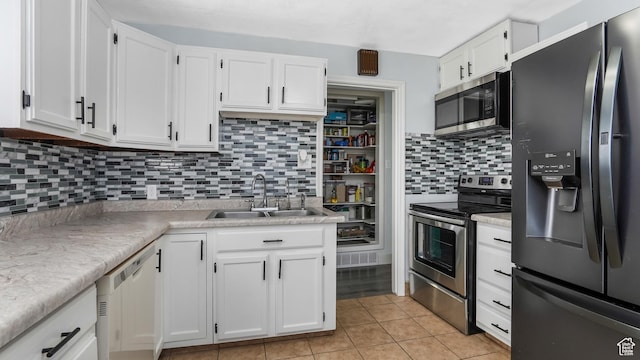 5460 S 4360 W, Kearns, UT 84118 - kitchen with a sink, light countertops, white cabinetry, and stainless steel appliances