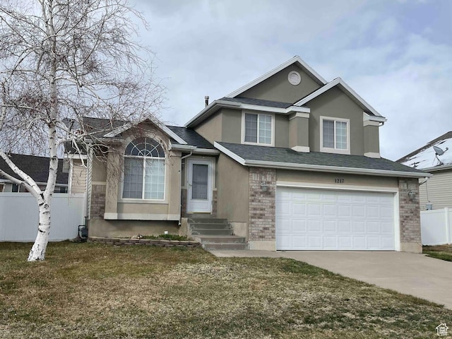 view of front of home with fence, driveway, stucco siding, entry steps, and a garage