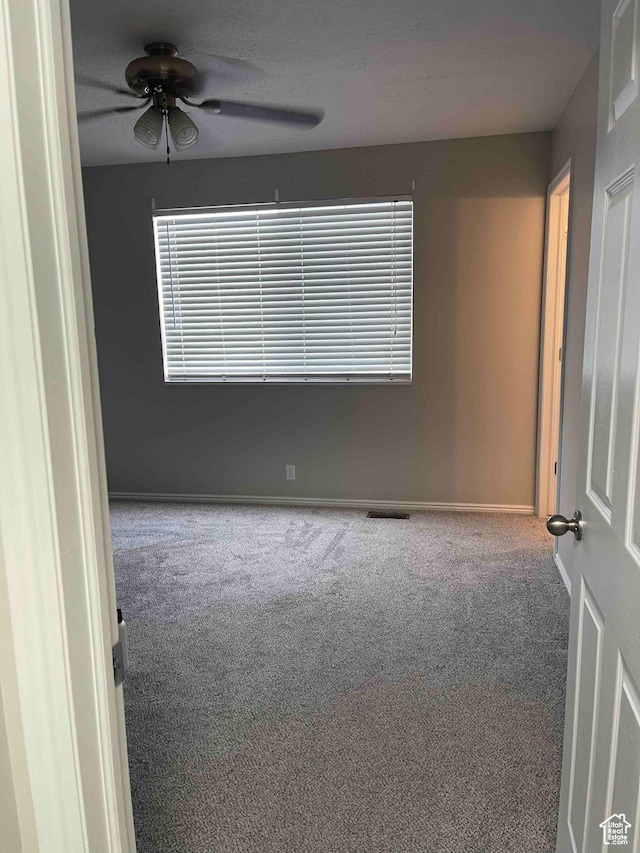 1217 E 3025 N, Layton, UT 84040 - unfurnished room with baseboards, ceiling fan, and carpet floors