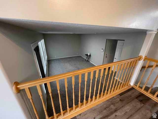 1217 E 3025 N, Layton, UT 84040 - stairs featuring baseboards, a textured ceiling, and wood finished floors