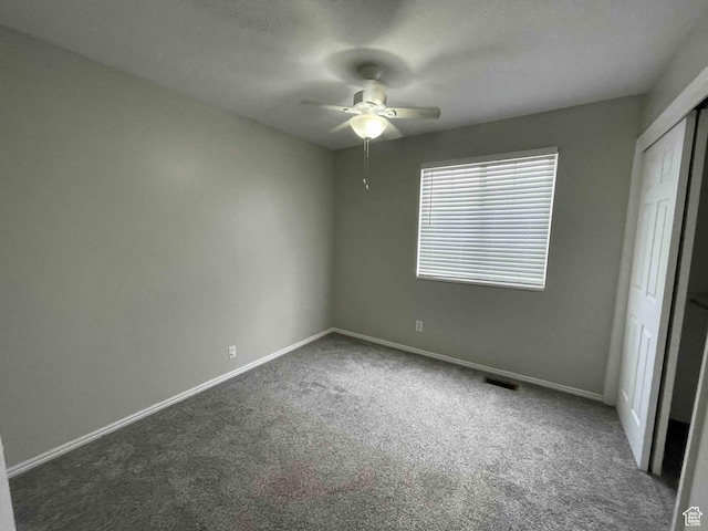 1217 E 3025 N, Layton, UT 84040 - unfurnished bedroom with visible vents, baseboards, and dark colored carpet