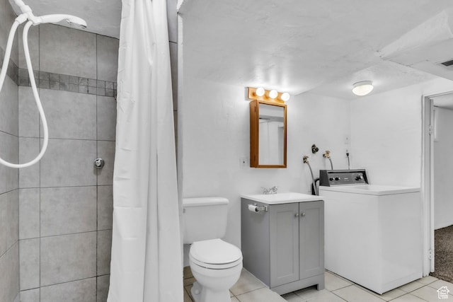 770 W 700 N, Provo, UT 84601 - full bath featuring washer / dryer, vanity, tile patterned flooring, toilet, and tiled shower