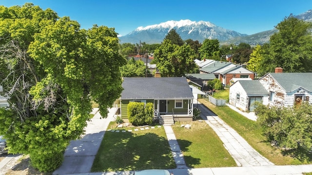 770 W 700 N, Provo, UT 84601 - view of front of house with covered porch, driveway, a mountain view, and a front yard