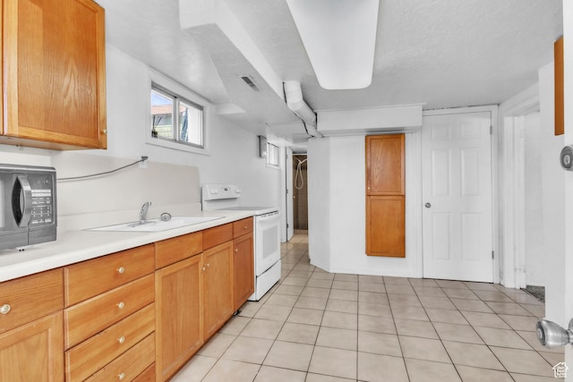 770 W 700 N, Provo, UT 84601 - kitchen with electric stove, black microwave, light countertops, a sink, and light tile patterned floors