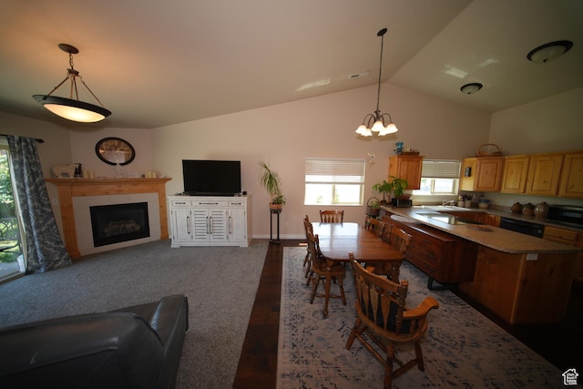 742 N Stonne Ln, Kaysville, UT 84037 - kitchen featuring stainless steel microwave, a tiled fireplace, vaulted ceiling, open floor plan, and a chandelier