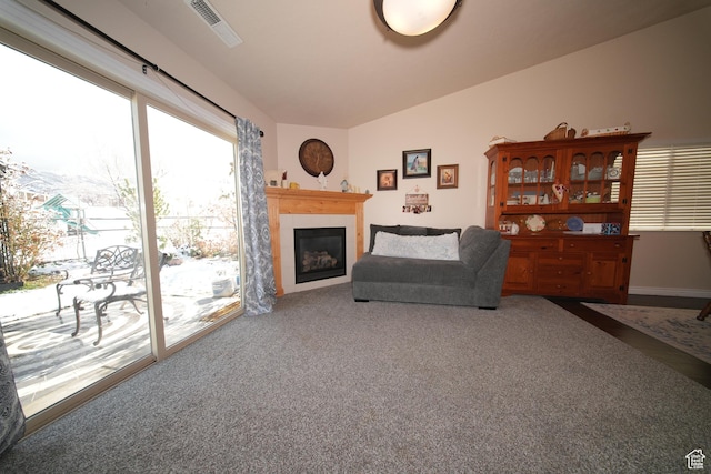 742 N Stonne Ln, Kaysville, UT 84037 - carpeted living room featuring a glass covered fireplace and lofted ceiling