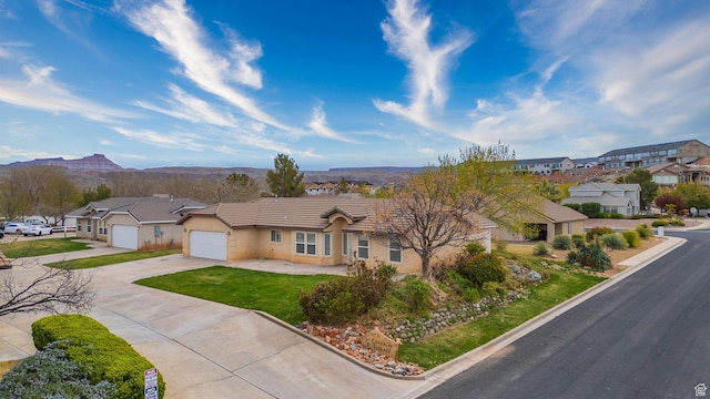2163 W 127 S, Hurricane, UT 84737 - single story home with concrete driveway, a tile roof, a residential view, stucco siding, and a mountain view