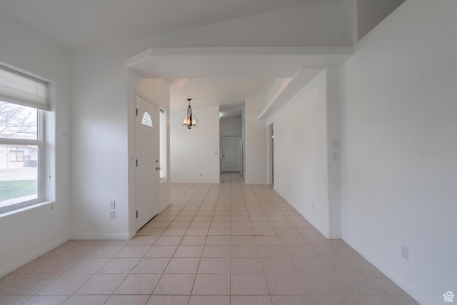 2163 W 127 S, Hurricane, UT 84737 - unfurnished room featuring light tile patterned floors, a notable chandelier, and baseboards