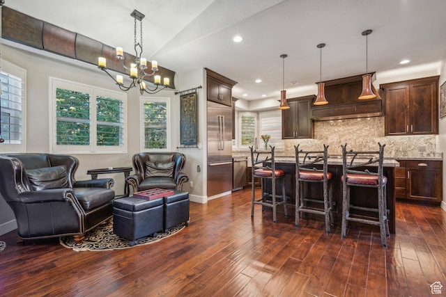 kitchen with tasteful backsplash, open floor plan, custom range hood, dark wood-style floors, and stainless steel appliances