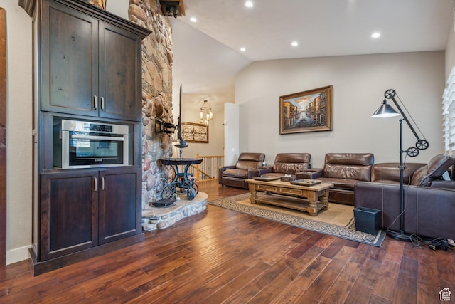 living area featuring recessed lighting, a chandelier, high vaulted ceiling, and dark wood-style floors