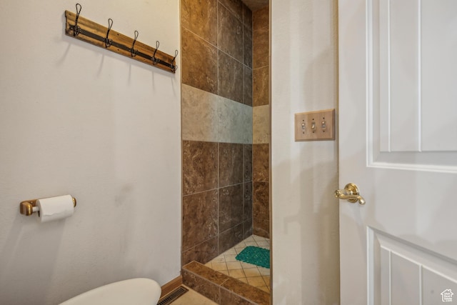 bathroom with visible vents, toilet, and a walk in shower