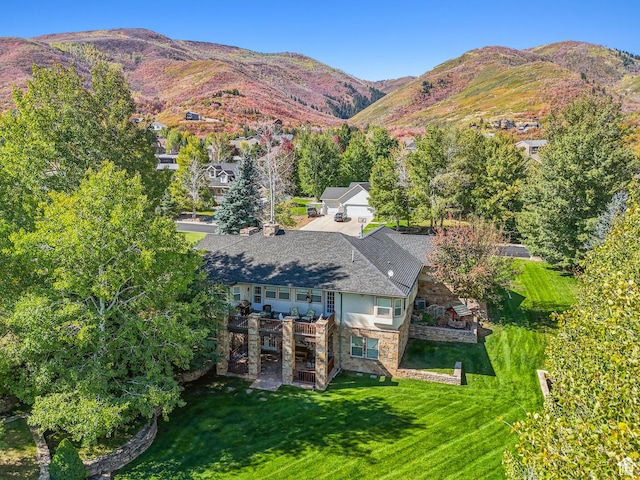 birds eye view of property featuring a mountain view