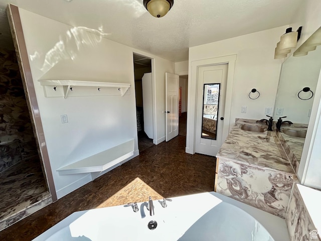 640 S 100 E, Mantua, UT 84324 - full bathroom with baseboards, a textured ceiling, a bath, and vanity