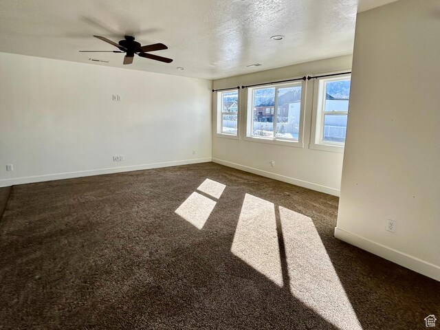 640 S 100 E, Mantua, UT 84324 - spare room with dark colored carpet, baseboards, a textured ceiling, and a ceiling fan