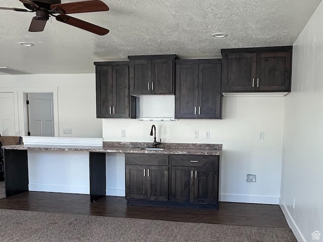 640 S 100 E, Mantua, UT 84324 - kitchen featuring ceiling fan, dark wood finished floors, baseboards, and a sink