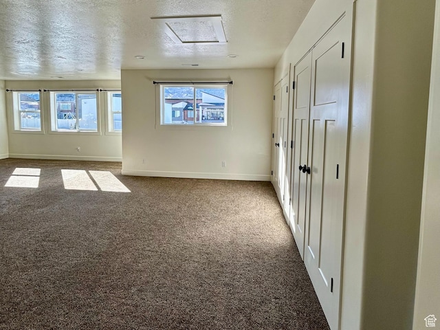 640 S 100 E, Mantua, UT 84324 - unfurnished bedroom with carpet flooring, a textured ceiling, and baseboards