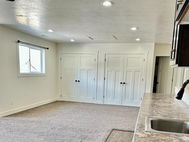 640 S 100 E, Mantua, UT 84324 - kitchen with baseboards, carpet floors, recessed lighting, a textured ceiling, and a sink