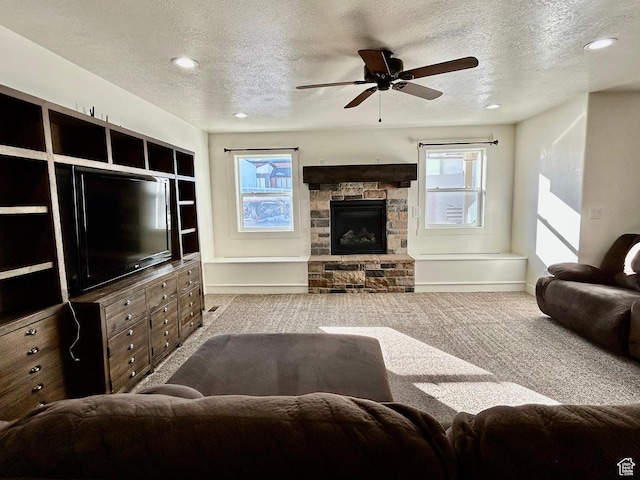 640 S 100 E, Mantua, UT 84324 - living room with carpet floors, a textured ceiling, a healthy amount of sunlight, and a ceiling fan