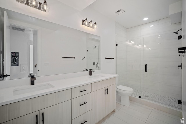 603 N Darwin St E Unit 10, Salt Lake City, UT 84103 - bathroom with double vanity, a stall shower, toilet, and a sink