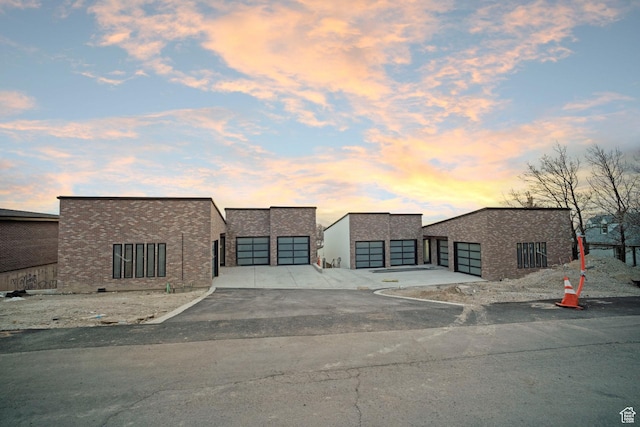 603 N Darwin St E Unit 10, Salt Lake City, UT 84103 - modern home featuring stucco siding, an attached garage, and concrete driveway