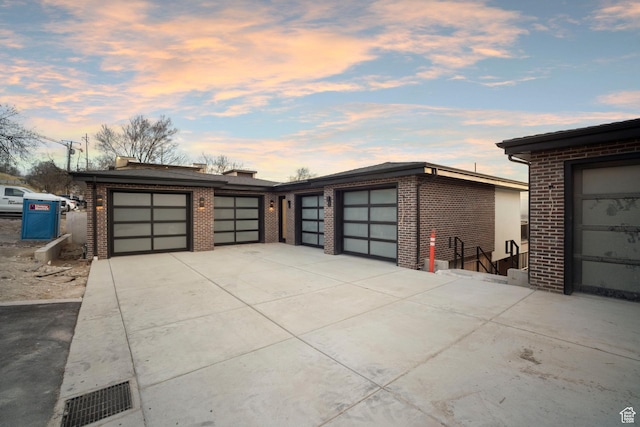 603 N Darwin St E Unit 10, Salt Lake City, UT 84103 - garage featuring visible vents and concrete driveway
