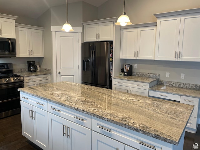 kitchen with double oven range, dark wood finished floors, white cabinets, lofted ceiling, and black refrigerator with ice dispenser