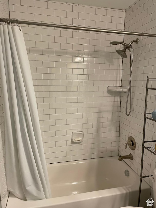 full bathroom with shower / bath combination with curtain
