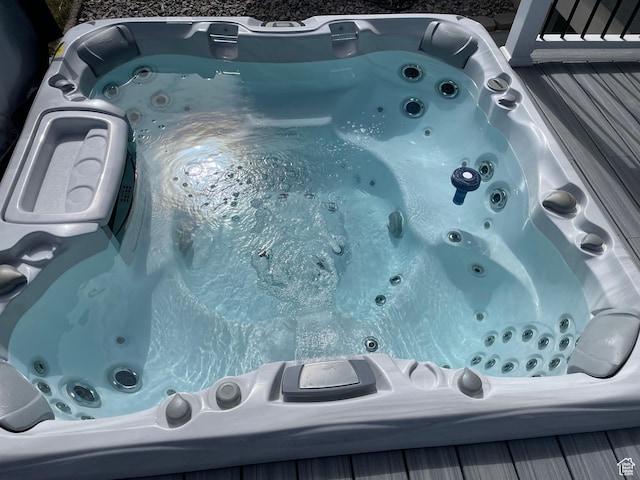exterior details with a hot tub