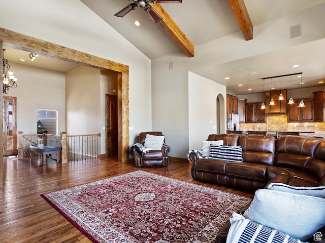 946 S Meadow Lark Ln E, Huntsville, UT 84317 - living area featuring visible vents, beamed ceiling, dark wood-type flooring, arched walkways, and ceiling fan with notable chandelier