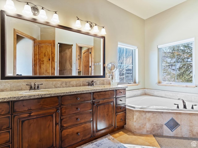 946 S Meadow Lark Ln E, Huntsville, UT 84317 - bathroom featuring double vanity, a sink, a garden tub, and tile patterned flooring