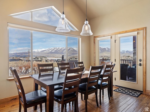 946 S Meadow Lark Ln E, Huntsville, UT 84317 - dining space with hardwood / wood-style floors, baseboards, a mountain view, and lofted ceiling
