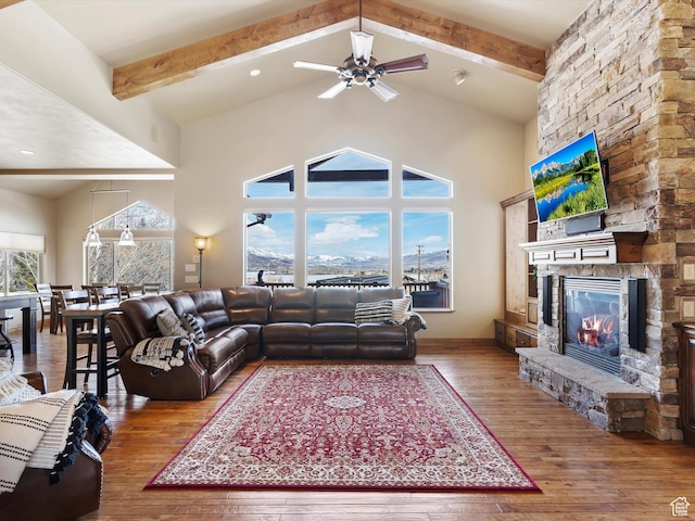 946 S Meadow Lark Ln E, Huntsville, UT 84317 - living room with a stone fireplace, high vaulted ceiling, beam ceiling, and wood-type flooring