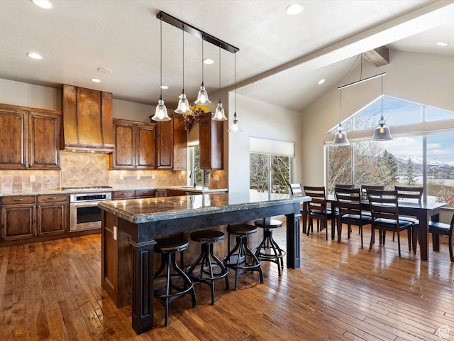 946 S Meadow Lark Ln E, Huntsville, UT 84317 - kitchen featuring dark wood-style floors, decorative backsplash, custom exhaust hood, and stainless steel appliances