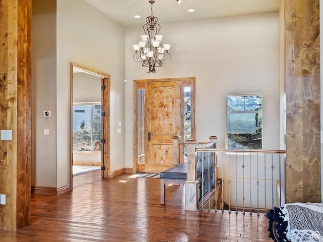 946 S Meadow Lark Ln E, Huntsville, UT 84317 - entrance foyer with a healthy amount of sunlight, a notable chandelier, a towering ceiling, and wood-type flooring