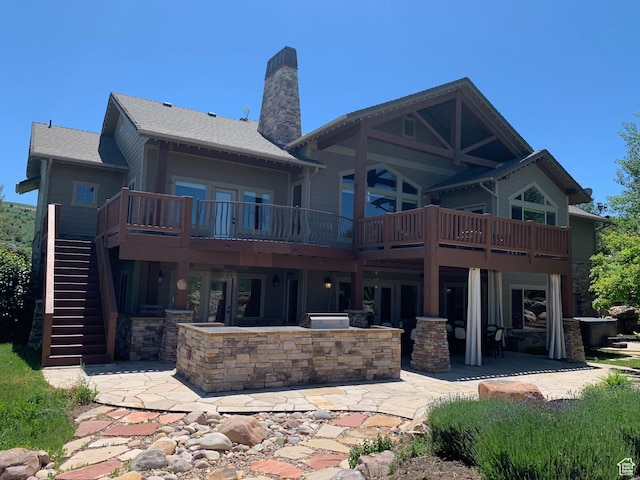 946 S Meadow Lark Ln E, Huntsville, UT 84317 - back of property featuring stairs, a wooden deck, stone siding, a patio, and a chimney