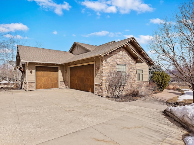 946 S Meadow Lark Ln E, Huntsville, UT 84317 - view of side of home with roof with shingles, an attached garage, stone siding, and concrete driveway