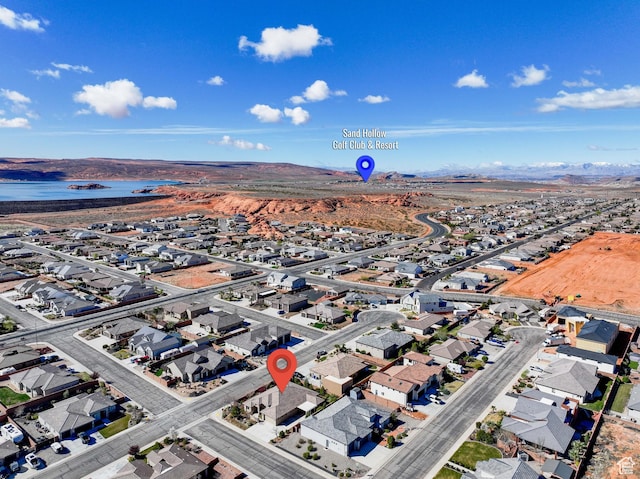 birds eye view of property with a residential view and a water view