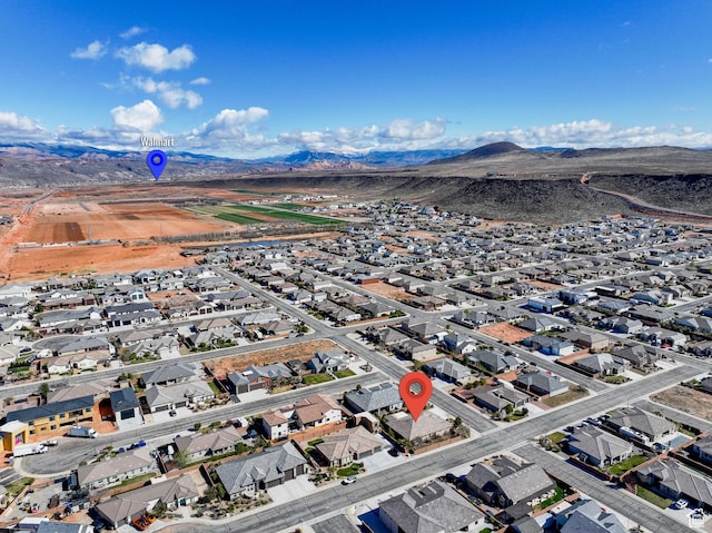 birds eye view of property with a residential view and a mountain view