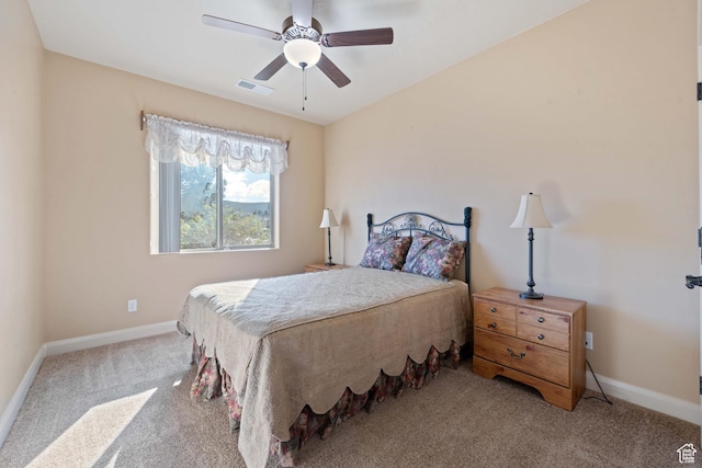 bedroom featuring visible vents, carpet flooring, baseboards, and ceiling fan