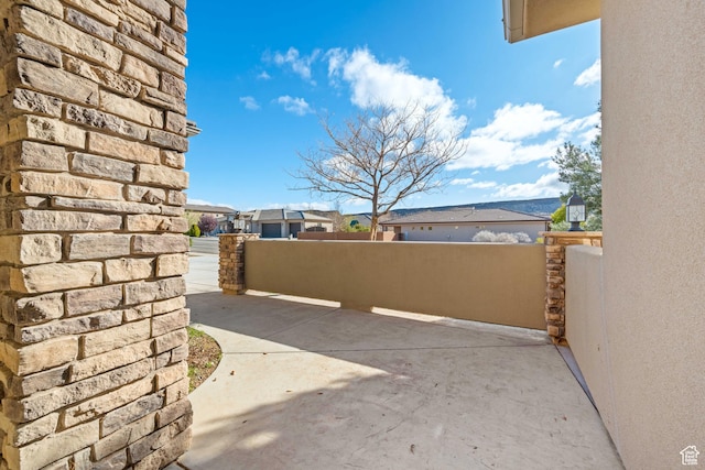 view of patio with a residential view
