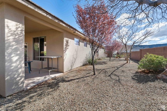 view of yard featuring a patio area and a fenced backyard