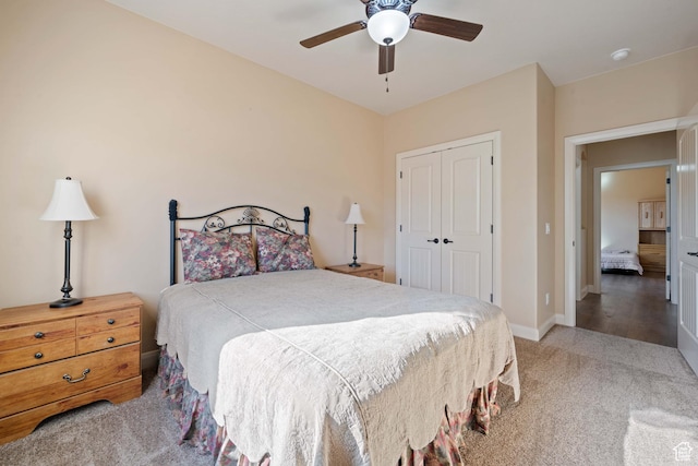 bedroom featuring a closet, ceiling fan, baseboards, and carpet floors