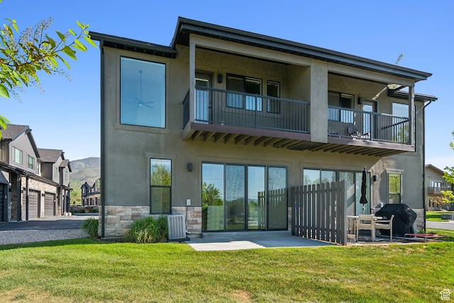 1127 N 520 W Unit 40, Midway, UT 84049 - rear view of house featuring a balcony, stucco siding, stone siding, and central air condition unit