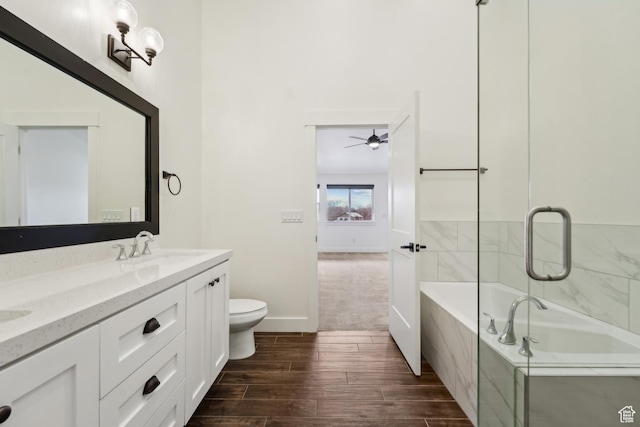1127 N 520 W Unit 40, Midway, UT 84049 - full bathroom featuring a bath, wood finished floors, toilet, double vanity, and ceiling fan