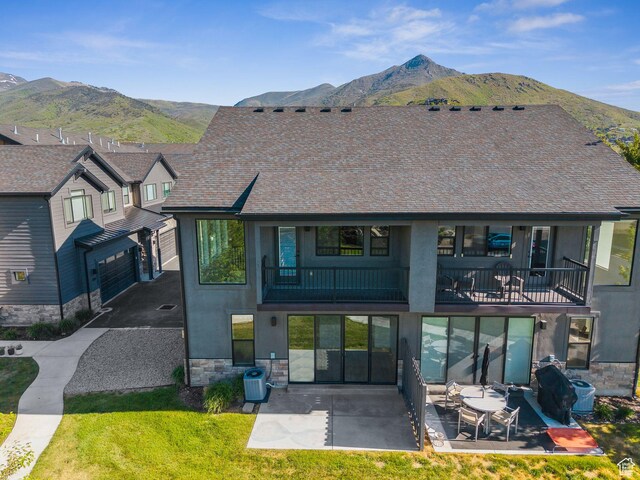 1127 N 520 W Unit 40, Midway, UT 84049 - rear view of property featuring a mountain view, stucco siding, stone siding, and a patio area
